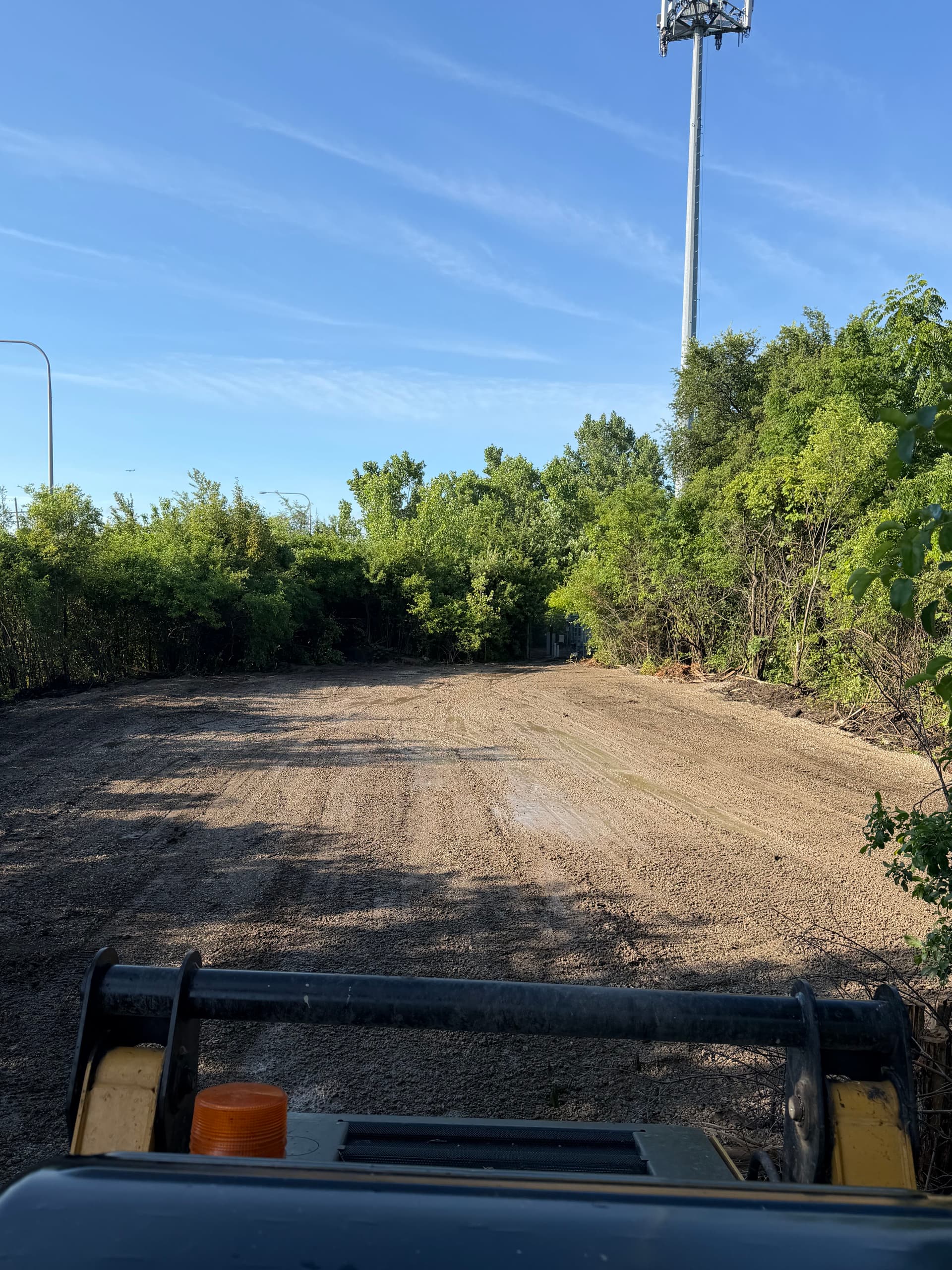Overgrown Lot Cleared and Graded Build-Ready for New Parking